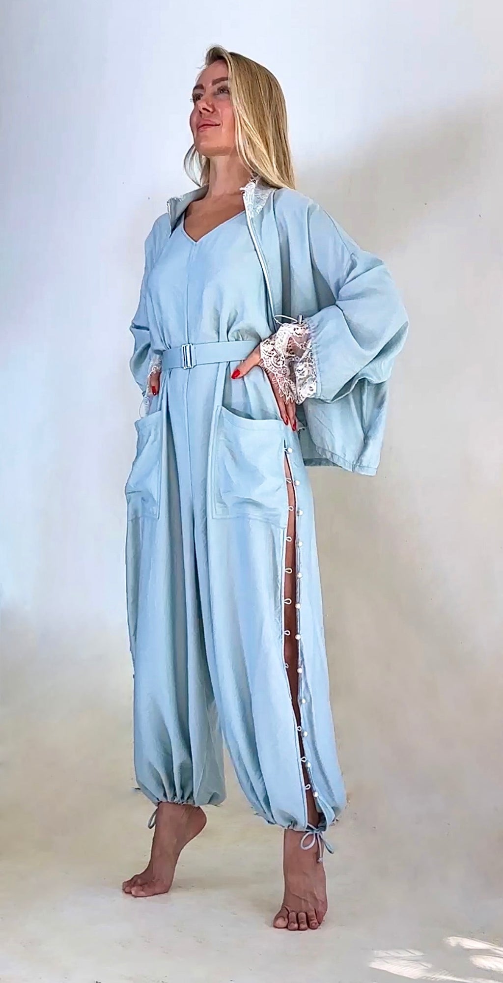 Luxury convertible jumpsuit with fluid draped sleeve styling