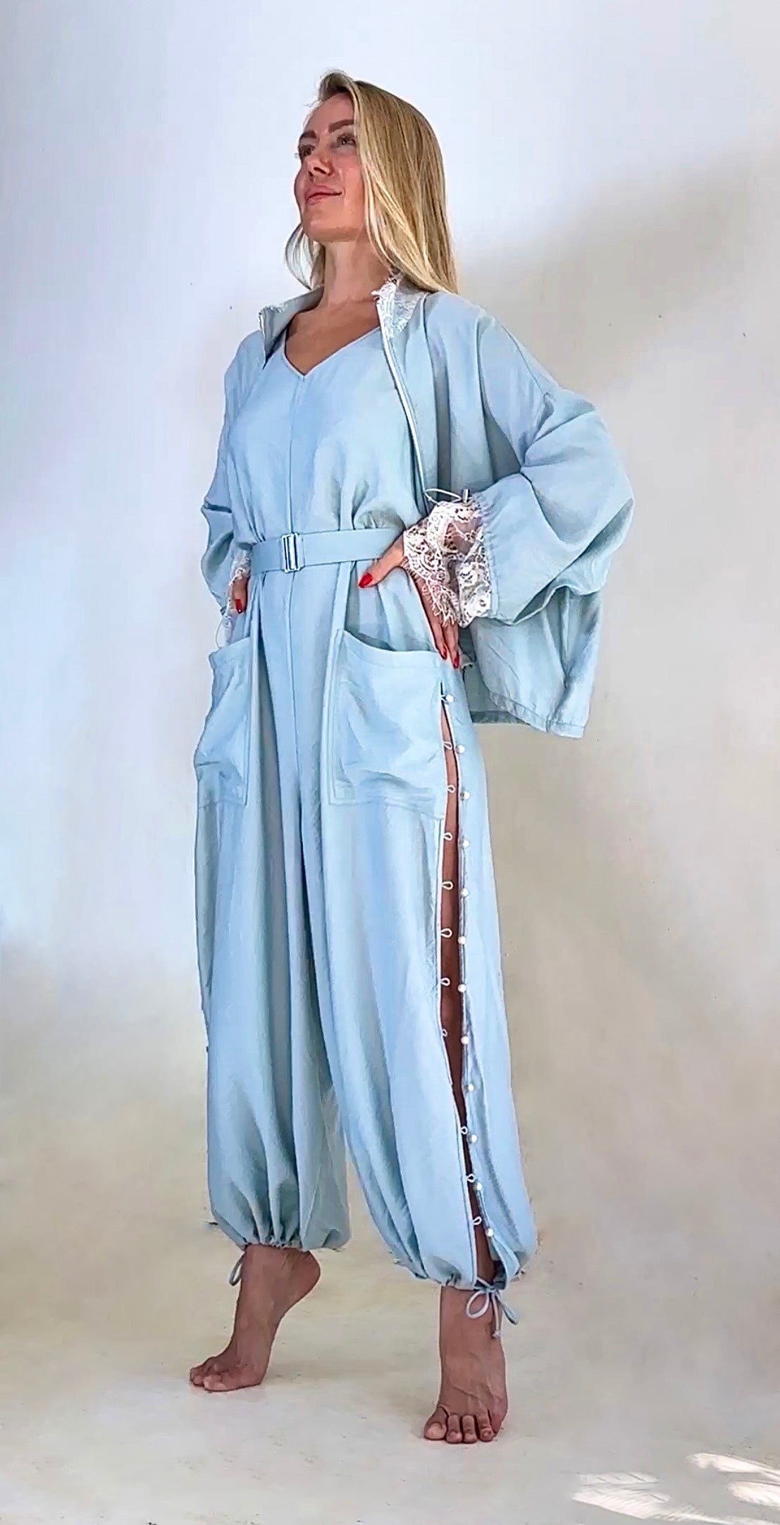 Luxury convertible jumpsuit with fluid draped sleeve styling